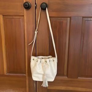 Leather bucket bag with tassels